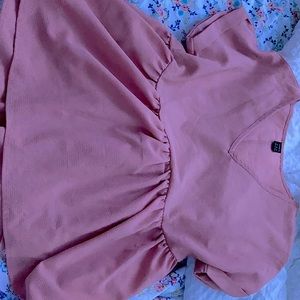 pink v-neck with ruffled bottom